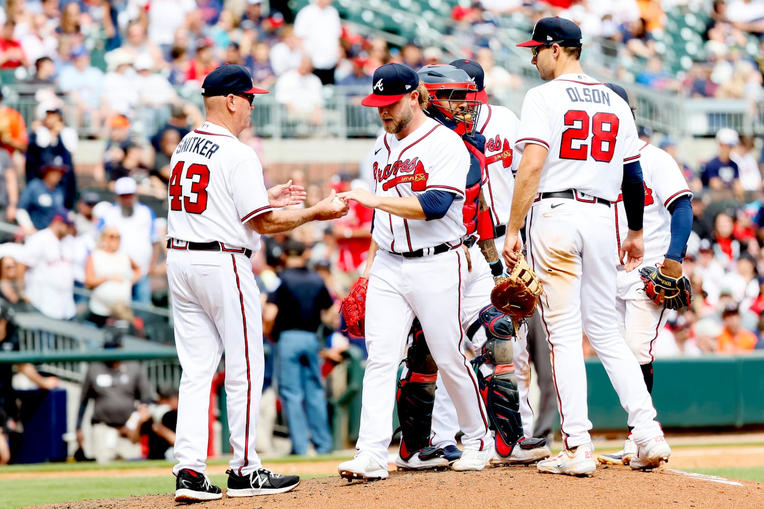 Braves relief pitcher A.J. Minter hands the ball to manager Brian Snitker after giving up the go-ahead two-run during the top of the eighth inning against the Astros at Truist Park, Sunday, April 23, 2023, in Atlanta.
Miguel Martinez / miguel.martinezjimenez@ajc.com 