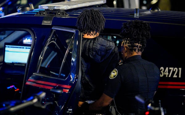 Atlanta police detain a man for questioning after the incident.