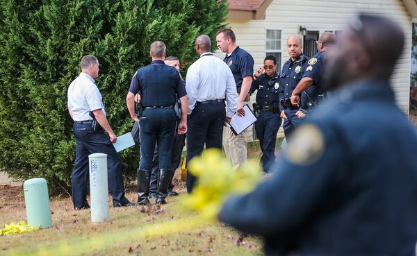 Police investigate the death of Cedric Clark, a 17-year-old student at Charles Drew High School in Clayton County. JOHN SPINK / JSPINK@AJC.COM