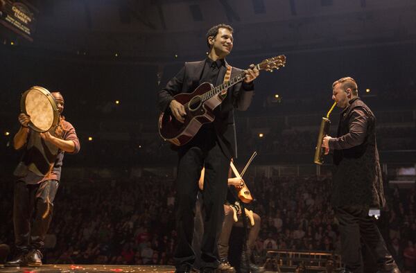 “Game of Thrones” soundtrack composer Ramin Djawadi joins fellow musicians onstage for the “Game of Thrones: Live Concert Experience.” The show will be at Philips Arena on March 14. CONTRIBUTED BY BARRY BRECHEISEN