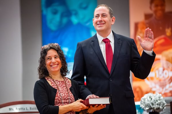 Atlanta Public Schools District 3 board member Ken Zeff, right, is sworn in on Monday, Jan. 8, 2024, at APS headquarters in downtown Atlanta. (Bita Honarvar for The Atlanta Journal-Constitution)