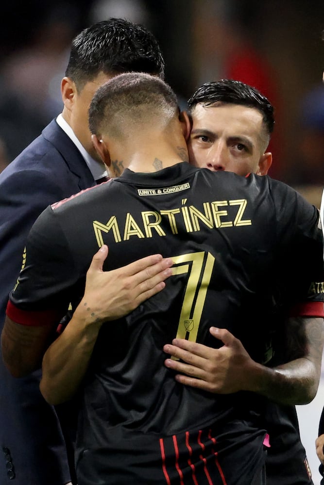 Atlanta United midfielder Ezequiel Barco, facing, hugs forward Josef Martinez (7) after their 3-2 win against D.C. United at Mercedes-Benz Stadium Saturday, September 18, 2021 in Atlanta, Ga.. JASON GETZ FOR THE ATLANTA JOURNAL-CONSTITUTION