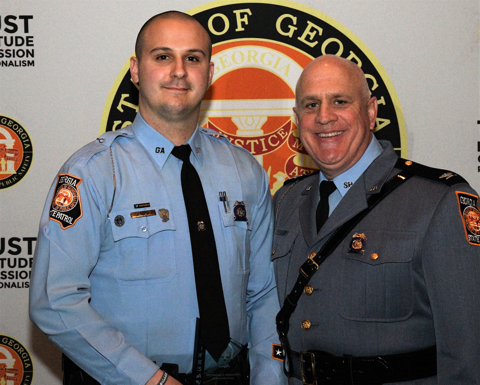 In this image posted on the Georgia Department of Public Safety’s Facebook page in March 2019, Georgia State Trooper Michael A. Tennant, left, is honored with a Lifesaving Award after assisting a motorist who had crashed on I-75. The following year he was involved in a pursuit on I-75 that resulted in two deaths when the car he was pursuing struck a vehicle in Midtown. GEORGIA DEPT. OF PUBLIC SAFETY