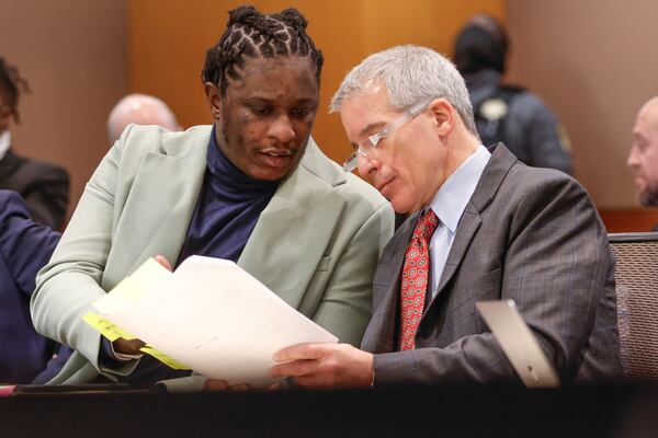 Atlanta rapper Young Thug speaks with defense attorney Brian Steel during his ongoing gang and racketeering trial at Fulton County Courthouse on Tuesday, Jan. 2, 2024. (Natrice Miller/ Natrice.miller@ajc.com)