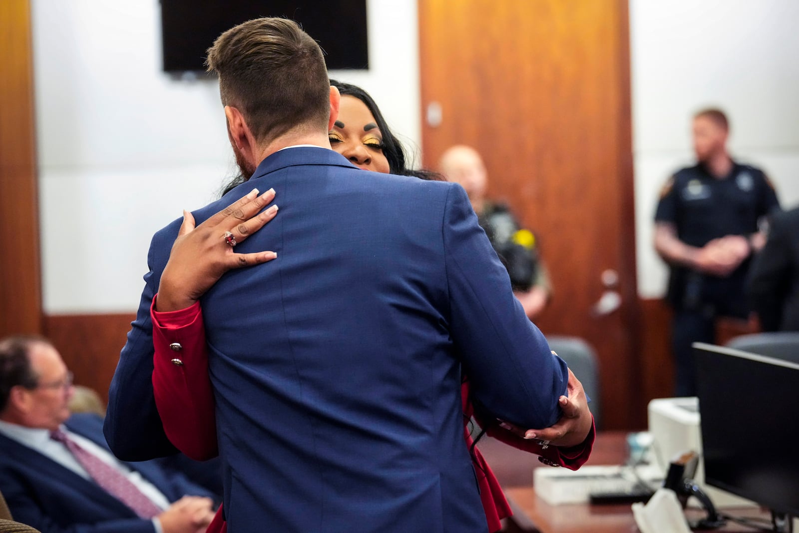 Prosecutors Keaton Forcht, left, and Tanisha Manning embrace just before former Houston police officer Gerald Goines was sentenced to 60 years behind bars on a pair of felony murder convictions on Tuesday, Oct. 8, 2024 in Houston. Goines was found guilty of felony murder in the 2019 deaths of Dennis Tuttle and Rhogena Nicholas. (Brett Coomer/Houston Chronicle via AP)