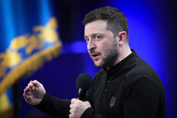 Ukrainian President Volodymyr Zelenskyy answers media questions during his press conference, in Kyiv, Ukraine, Sunday, Feb. 23, 2025. (AP Photo/Evgeniy Maloletka)