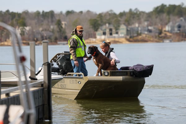 Laurence Walker, a volunteer with the Cajun Navy Relief, left, takes a cadaver dog and the dog’s handler out on Lake Oconee to search for Gary Jones, Tuesday, February, 18, 2025, in Eatonton, Ga. The Putnam County sheriff is investigating and searching after Spelman College instructor Joycelyn Nicole Wilson and an Atlanta private school coach Gary Jones went missing on Lake Oconee over a week ago, Saturday Feb. 8th. The body of Wilson was found Sunday, Feb. 9th and Jones has not been found. (Jason Getz / AJC)