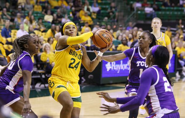 FILE - Baylor guard Sarah Andrews (24) shoots through the TCU defense in the first half of an NCAA college basketball game, Saturday, Dec. 31, 2022, in Waco, Texas. (Rod Aydelotte/Waco Tribune-Herald via AP)