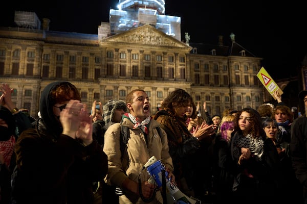 Pro-Palestinian supporters protest in Amsterdam, Netherlands, Wednesday, Nov. 13, 2024, despite a city ban on such gatherings. (AP Photo/Bram Janssen)