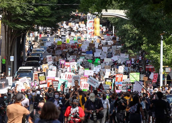 June 15, 2020 -  Atlanta - A crowd of demonstrators march to the Capitol.   The NAACP March to the Capitol coincided with the restart of the Georgia 2020 General Assembly.  Lawmakers returned wearing masks and followed new rules to restart the session during the pandemic.   Steve Schaefer for the Atlanta Journal Constitution