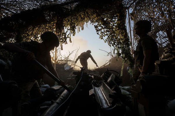 FILE - Ukrainian servicemen prepare towarda Wong fire towards Russian positions at the frontline in Donetsk region, Ukraine, Wednesday, August 21, 2024. (AP Photo/Evgeniy Maloletka, File)