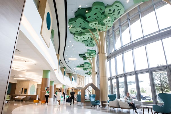 Chief Administrative Officer of Children’s Healthcare of Atlanta Linda Matzigkeit (second from left) walks through the lobby of the new Arthur M. Blank Pediatric Hospital in Atlanta on Tuesday. The 19-story, 2 million-square-foot facility, expected to be one of the most advanced pediatric hospitals in the country, will open on September 29. CHRISTINA MATACOTTA FOR THE ATLANTA JOURNAL-CONSTITUTION