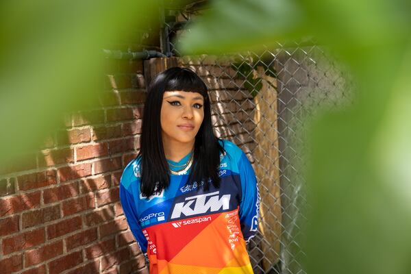 Ree De La Vega, who has taken over the lease of former restaurant and lounge The Sound Table, poses for a portrait outside the building in Atlanta on Tuesday, April 16, 2024. (Arvin Temkar / arvin.temkar@ajc.com)