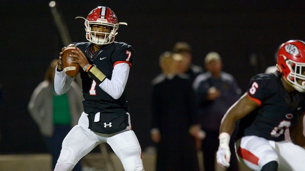 Woodward quarterback Mike Wright (7) drops back for a pass in the Class AAAA semifinal game against Blessed Trinity Friday, Dec. 6, 2019.