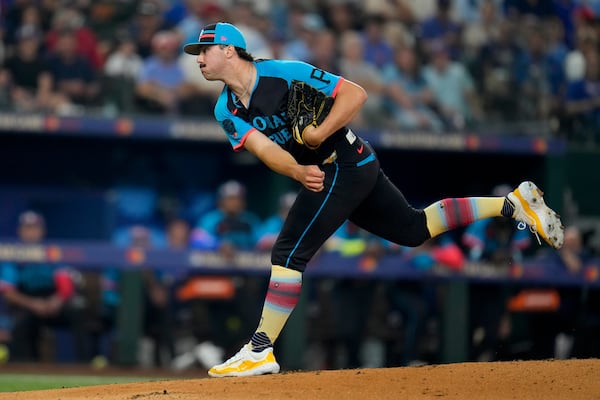 FILE - National League pitcher Paul Skenes, of the Pittsburgh Pirates, throws to an American League batter in the first inning during the MLB All-Star baseball game, Tuesday, July 16, 2024, in Arlington, Texas. (AP Photo/Julio Cortez, File)