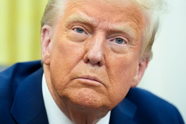 U.S. President Donald Trump sits in the Oval Office after signing executive orders of the White House in Washington, D.C., on Thursday, Jan. 23, 2025. (Yuri Gripas/Abaca Press/TNS)