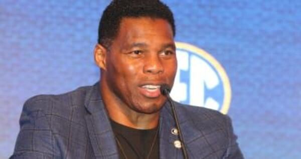 Herschel Walker’s campaign condemns bigotry, protesters want his thoughts on vaccine