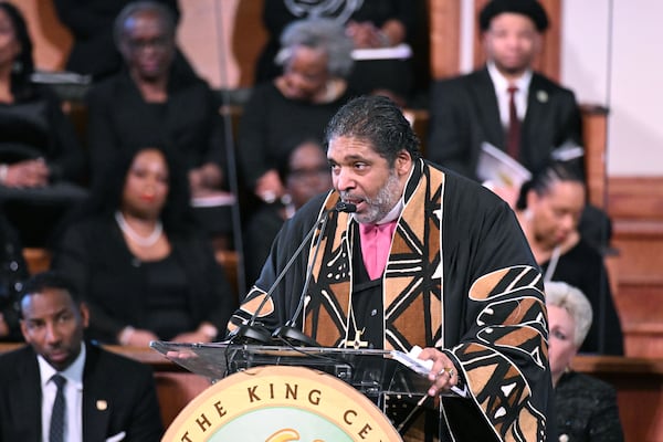 Rev. Dr. William J. Barber II delivers keynote speech during the 57th Martin Luther King, Jr. Beloved Community Commemorative Service at Ebenezer Baptist Church, Monday, January 20, 2025, in Atlanta. (Hyosub Shin / AJC)