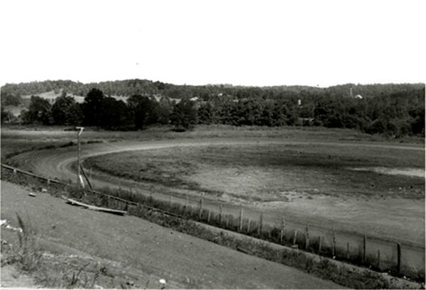 At times, water levels at Lake Lanier dip enough to expose what's below, such as shell of the Gainesville Speedway, covered when the federal government built Buford Dam and filled the lake in the 1950s. It's under the water near Laurel Park in Gainesville. David Coughlin made this print from negatives owned by the U.S. Army Corps of Engineers.