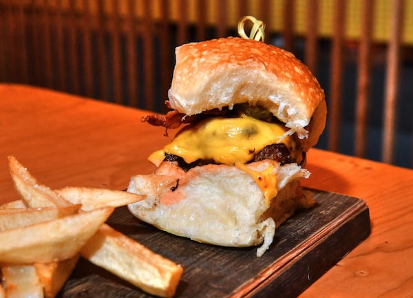 Federal Burger's Cheese Burger and Fries with Truffle Aioli is among the many offerings at the new Politan Row at Colony Square. (Chris Hunt for The Atlanta Journal-Constitution)