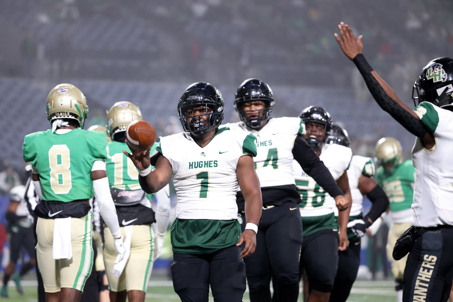 Langston Hughes running back Antonio Martin (1) celebrates his rushing touchdown in the first half against Buford in the Class 6A state title football game at Georgia State Center Parc Stadium Friday, December 10, 2021, Atlanta. JASON GETZ FOR THE ATLANTA JOURNAL-CONSTITUTION