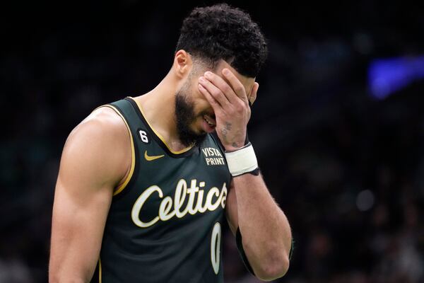 Boston Celtics forward Jayson Tatum reacts during Game 5 in the first round of the NBA basketball playoffs, Tuesday, April 25, 2023, in Boston. The Atlanta Hawks defeated the Boston Celtics 119-117. (AP Photo/Charles Krupa)