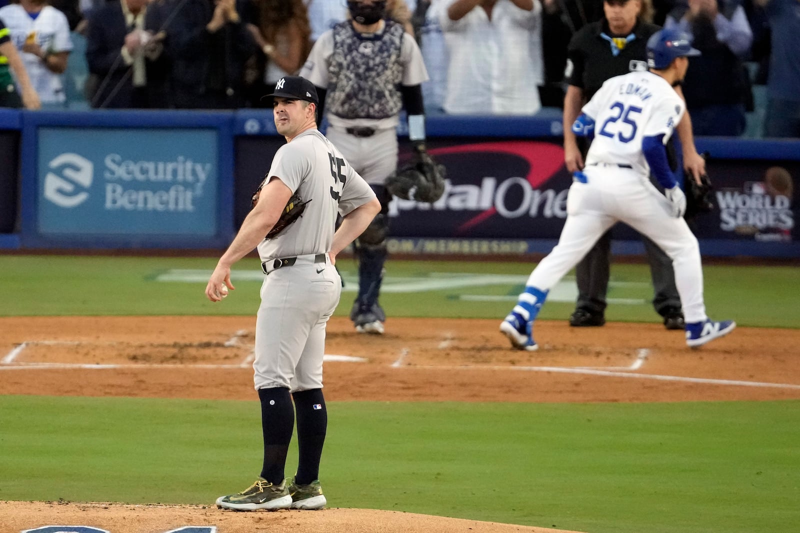 New York Yankees starting pitcher Carlos Rodón (55) looks to the outfield after giving up a home run to Los Angeles Dodgers' Tommy Edman (25) during the second inning in Game 2 of the baseball World Series, Saturday, Oct. 26, 2024, in Los Angeles. (AP Photo/Julio Cortez)