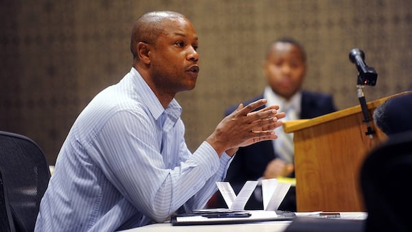 Damany Lewis speaks a tribunal in 2012 that would eventually decide to terminate his contract with the APS. (Bita Honarvar / bhonarvar@ajc.com)