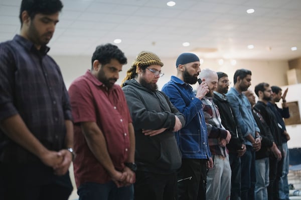 Salah Eddine Benatia, center, speaks during a community gathering to discuss plans for Ramadan held for members of Masjid Al-Taqwa, held at a school in Pasadena, California, Saturday, Feb. 15, 2025. (AP Photo/Eric Thayer)