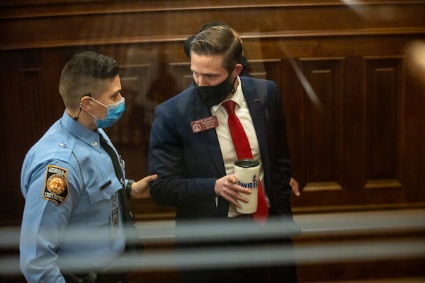 Georgia State Representative David Clark is removed from the state house chamber by Georgia State Trooper Justice after refusing to take Covid-19 tests in Atlanta, Georgia on January 26th. MANDATORY CREDIT: NATHAN POSNER