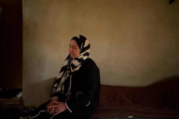 Lamia Ballal, wife of Hamdan Ballal, a co-director of the Oscar winner documentary "No Other Land", looks on as she sits at their house in the village of Susiya in Masafer Yatta, south Hebron hills, Tuesday, March 25, 2025. (AP Photo/Leo Correa)