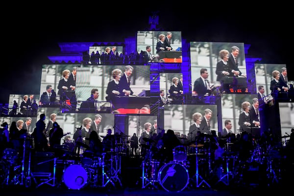 Musicians play on the stage during the concert for freedom for the 35th anniversary of the fall of the Berlin Wall, at the Brandenburg Gate in Berlin, Germany, Saturday, Nov. 9, 2024. (AP Photo/Ebrahim Noroozi)