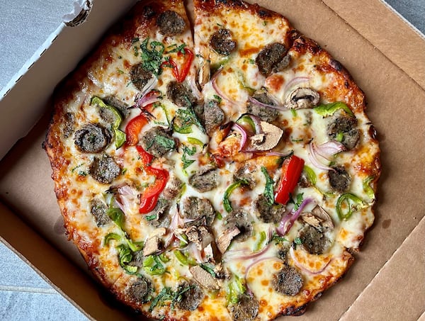 You can get a seekh kabab sausage pizza at Tandoori Pizza and Wing Co. Henry Hollis for The Atlanta Journal-Constitution