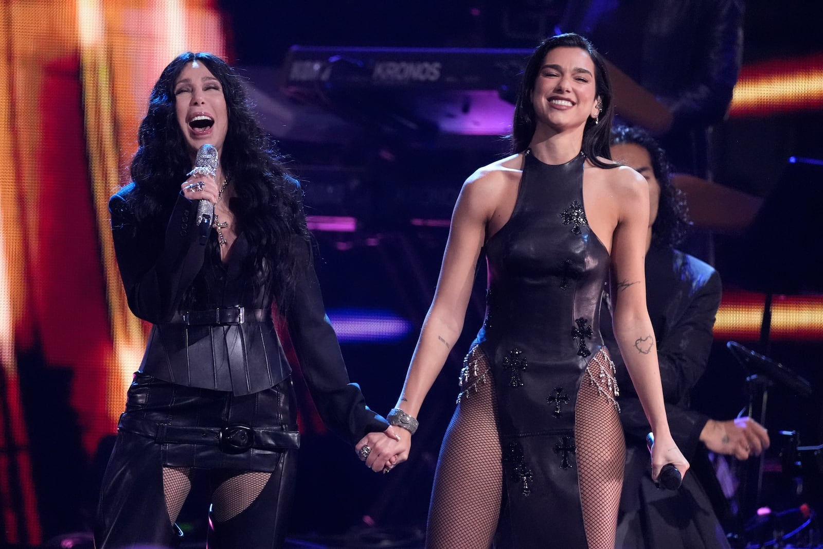 Cher, left, and Dua Lipa perform during the 39th Annual Rock & Roll Hall of Fame Induction Ceremony on Saturday, Oct. 19, 2024, at Rocket Mortgage FieldHouse in Cleveland. (AP Photo/Chris Pizzello)