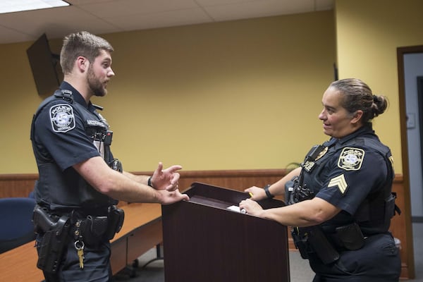 01/15/2019 — Marietta, Georgia — Marietta Police Officer Connor McDonald (left) speaks with Marietta Police Sgt. Gretchen Ingram (right) following the evening shift roll call at Marietta Police Department, Wednesday, January 15, 2020. (ALYSSA POINTER/ALYSSA.POINTER@AJC.COM)