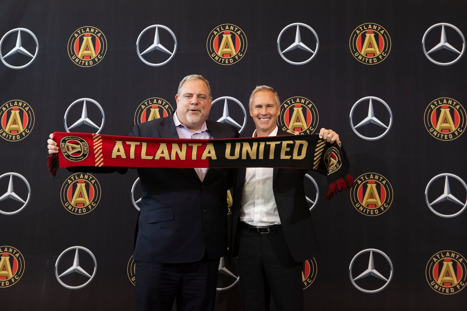 Chris Henderson (right), the newly appointed chief soccer officer and sporting director of Atlanta United, and Garth Lagerwey (left), president and chief executive officer of Atlanta United, pose for a photo during a press conference introducing Henderson as the new technical director on Tuesday, December 17, 2024, at the Atlanta United training grounds in Marietta, Georgia. CHRISTINA MATACOTTA FOR THE ATLANTA-JOURNAL CONSTITUTION.


