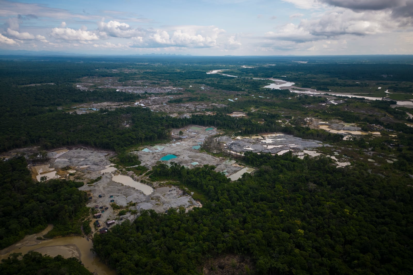 Visible deforestation from illegal mining surrounds the Quito River, near Paimado, Colombia, Monday, Sept. 23, 2024. (AP Photo/Ivan Valencia)