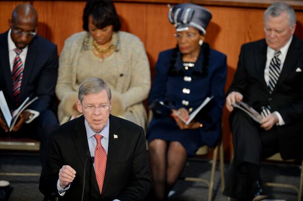 U.S. Sen. Johnny Isakson gives remarks during the the 46th annual Martin Luther King Jr. Commemorative Service at Ebenezer Baptist Church Monday, Jan. 20, 2014. Behind him on the podium are the Rev. Raphael Warnock (left), senior pastor of Ebenezer, Bernice King, Christine King Farris and Gov. Nathan Deal. (AJC file photo / Kent D. Johnson)