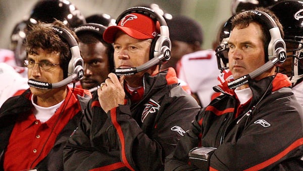 070810 EAST RUTHERFORD, N.J.: --Assistant coach defensive line Kevin Wolthausen, left, head coach Bobby Petrino, center, and defensive coordinator Mike Zimmer look on as the Jets make a drive during 2nd half action at the Meadowlands in East Rutherford, N.J., Friday, August 10, 2007.