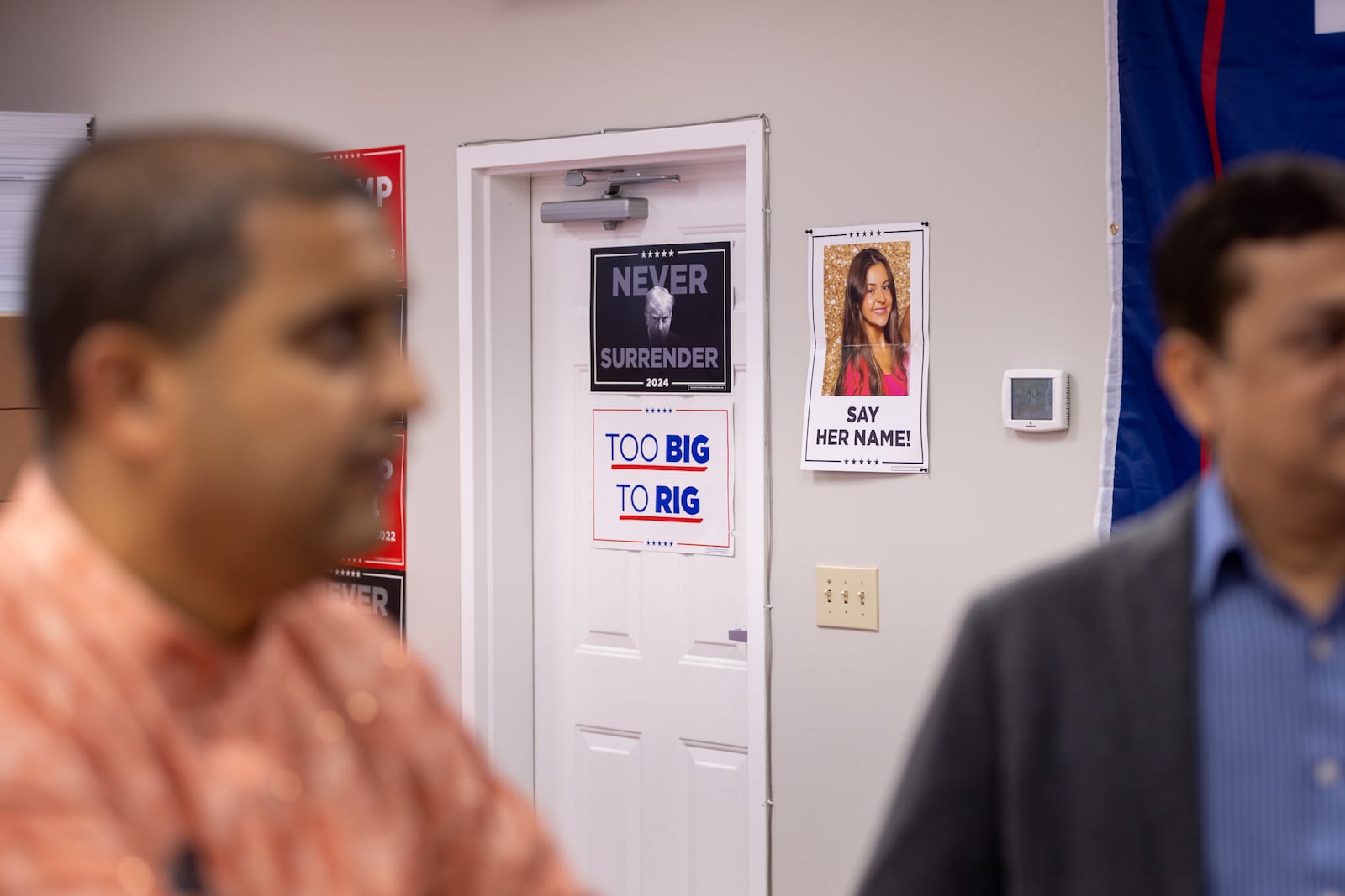 Georgia GOP Chairman Josh McKoon told participants at an Indians for Trump event that the father of one of his childhood friends, who is of Indian descent, had immigrated from Kenya and became the first gastroenterologist in the Columbus area. "But you know what? He did it the legal way. He did it the right way," McKoon said. "He followed and respected the American laws on immigration. That's all we want. We're not saying no to immigrants. Immigrants built this country. We need legal immigration."
Posters featuring Republican presidential candidate Donald Trump and Laken Riley, a nursing student killed in February, appear in a Republican campaign office on Sunday, Oct. 6, 2024. Riley, whose accused killer is undocumented, has been a focus of political discussion on immigration.