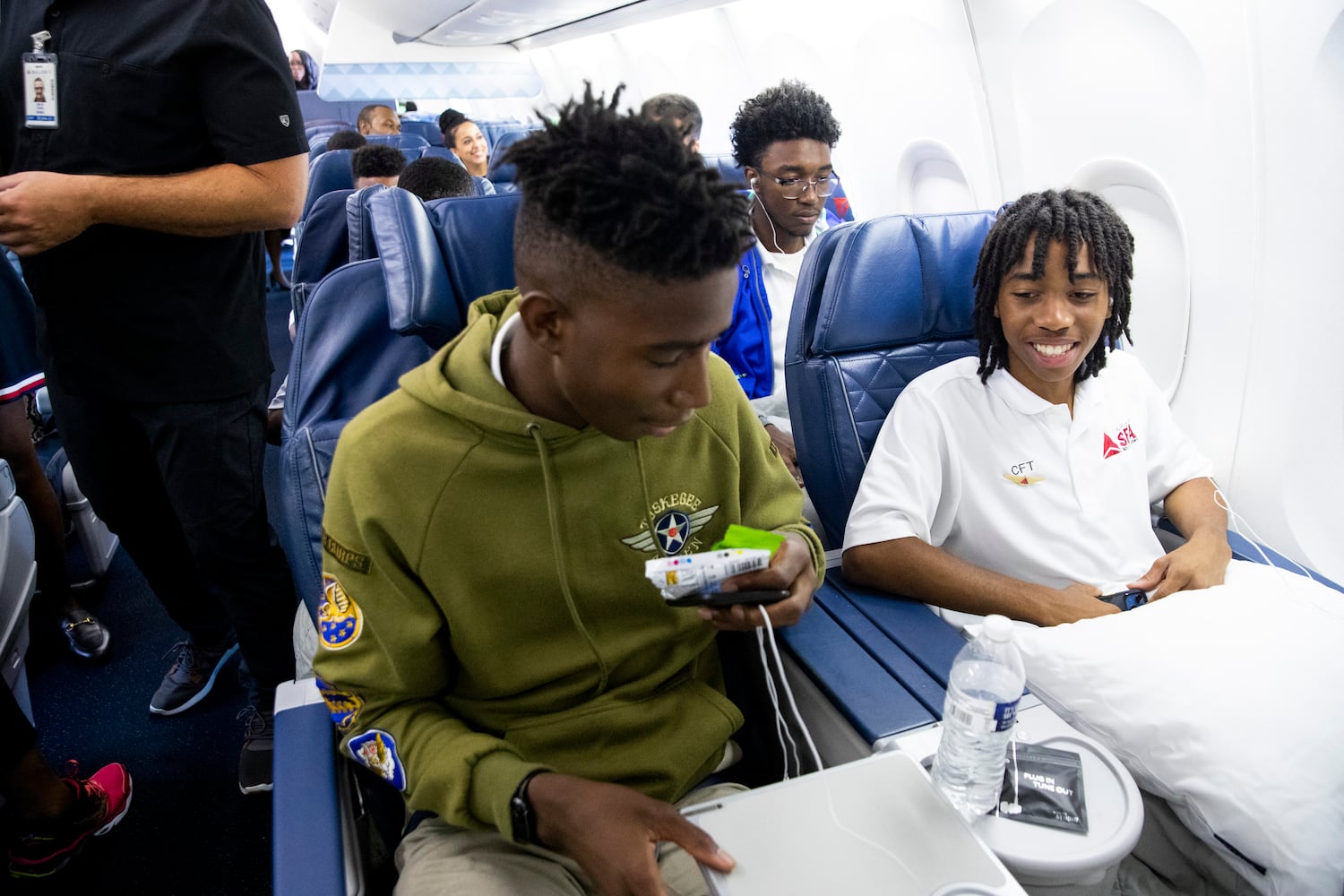 Participants of Delta’s Dream Flight 2022 get settled in their seats aboard a plane at Hartsfield-Jackson Atlanta International Airport on Friday, July 15, 2022. Around 150 students ranging from 13 to 18 years old will fly from Atlanta to the Duluth Air National Guard Base in Duluth, Minnesota. (Chris Day/Christopher.Day@ajc.com)