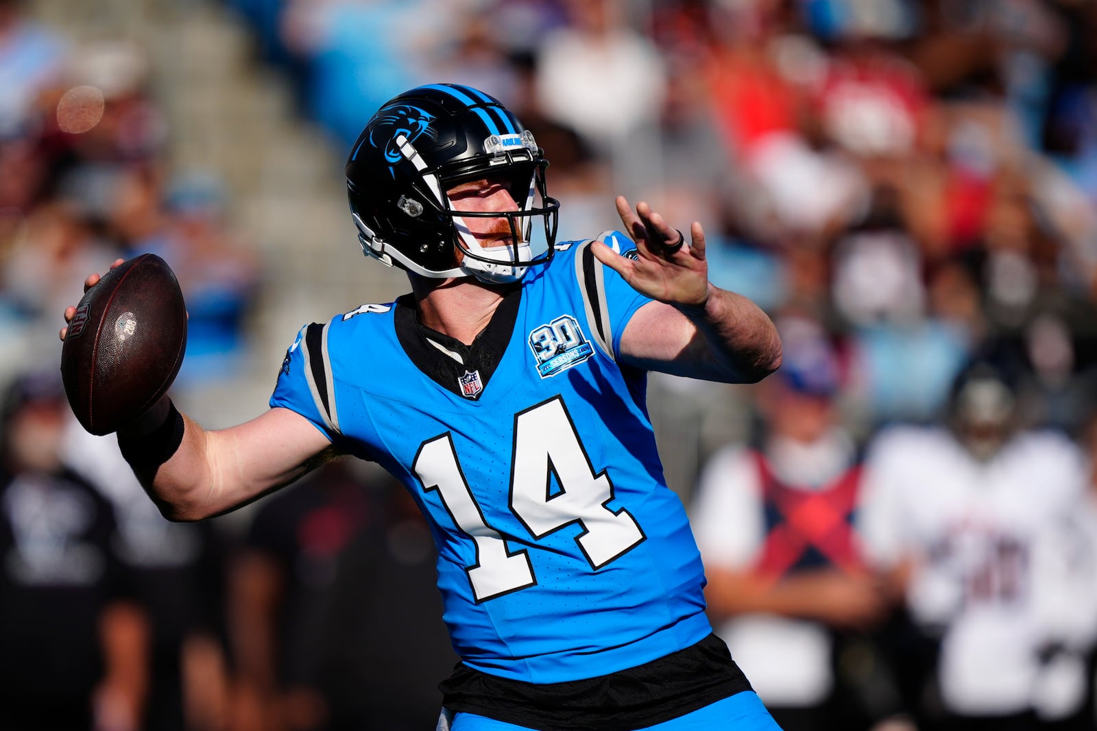 Carolina Panthers quarterback Andy Dalton (14) sets back to pass the ball in the first half of an NFL football game against the Atlanta Falcons in Charlotte, N.C., Sunday, Oct. 13, 2024. (AP Photo/Jacob Kupferman)