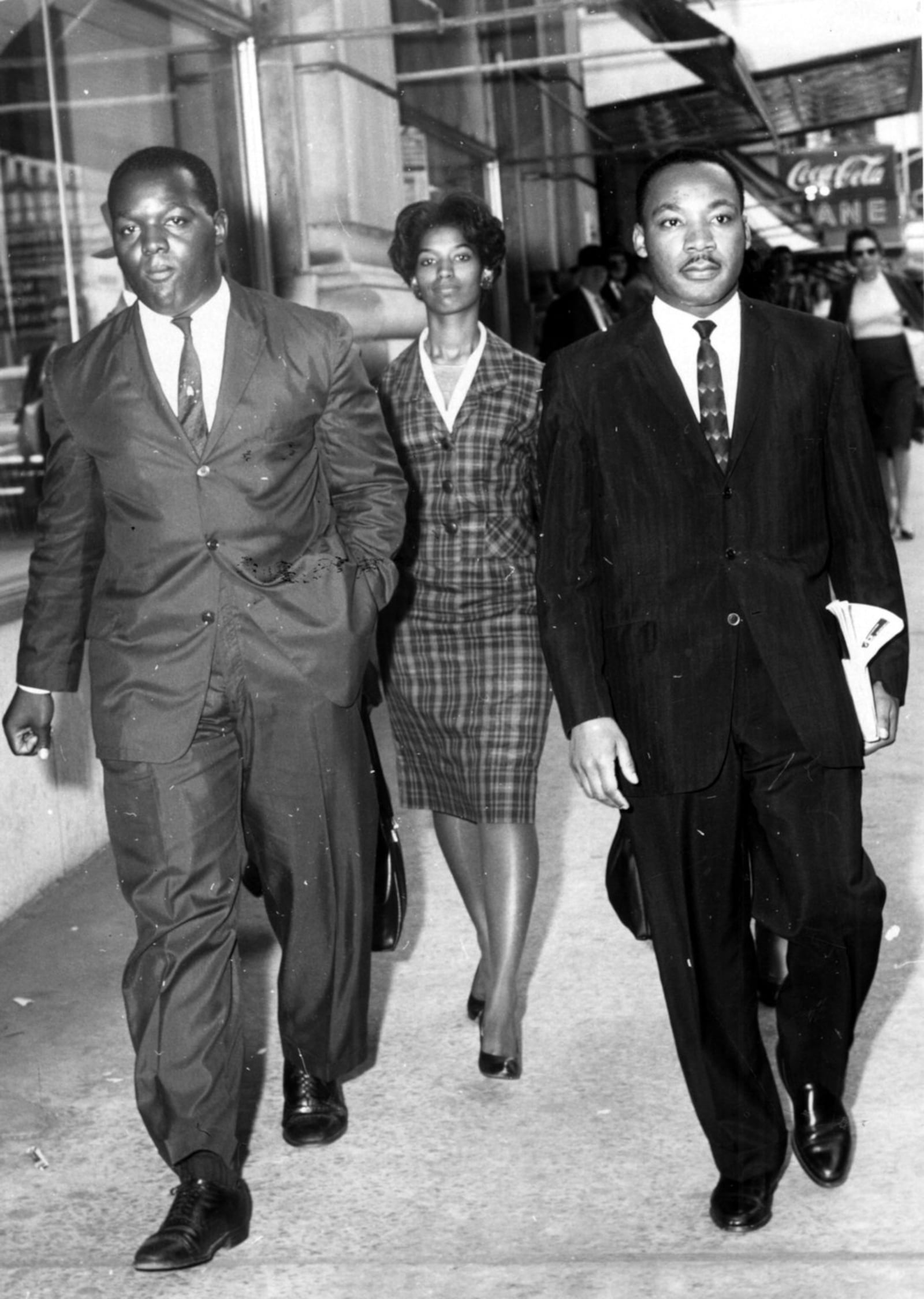 Oct. 18,1960 - ATLANTA, GA - Demonstrators (l-r) Lonnie King, MARILYN PRYCE (according to a source) and Martin Luther King Jr. are taken to a police car after being arrested for a sit-in protest at Rich’s. (Charles Jackson/AJC staff) 1960