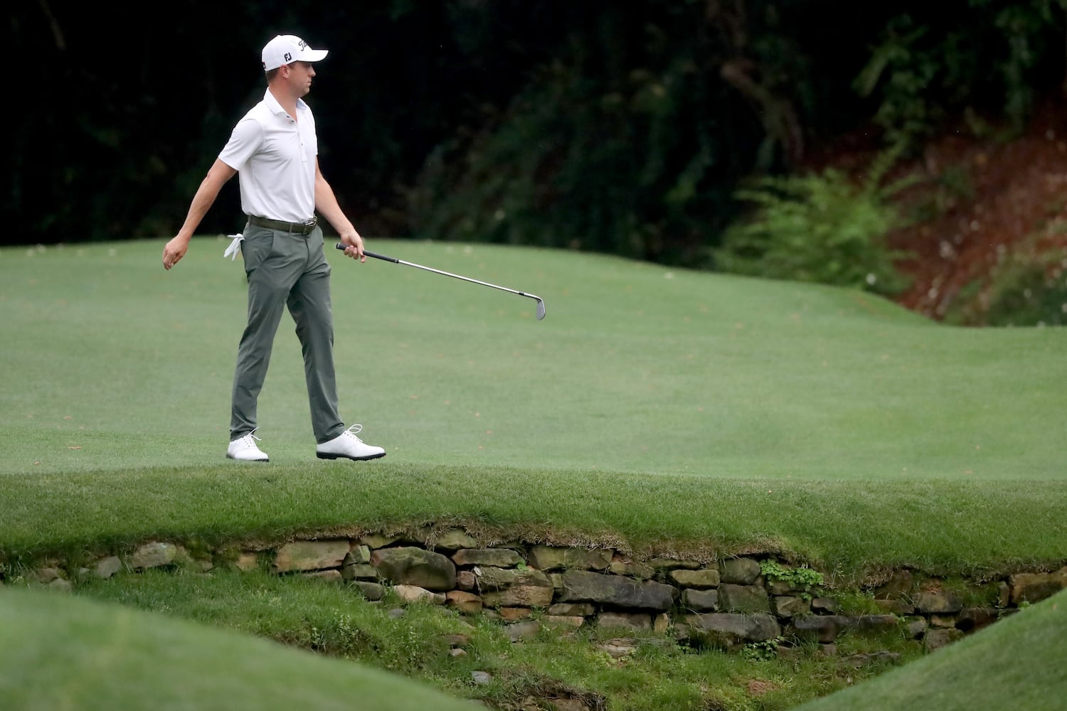 April 10, 2021, Augusta: Justin Thomas reacts after hitting over the tributary to RaeÕs Creek on the thirteenth hole during the third round of the Masters at Augusta National Golf Club on Saturday, April 10, 2021, in Augusta. Curtis Compton/ccompton@ajc.com