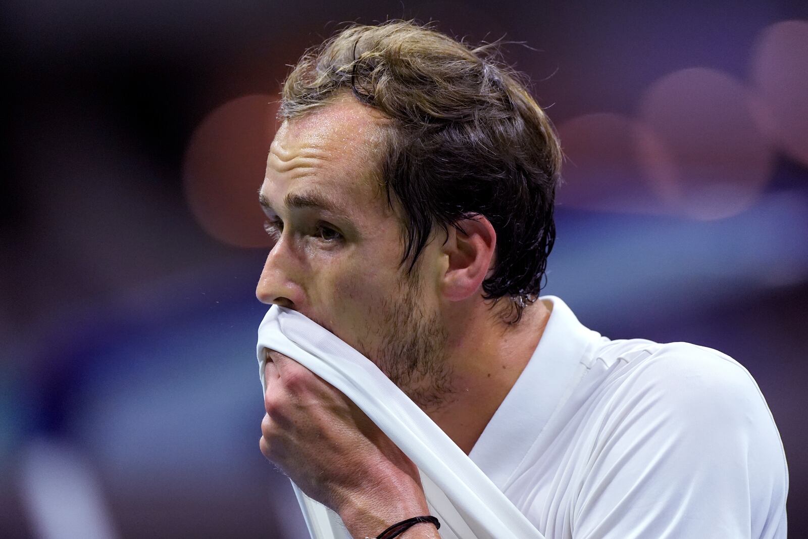 Daniil Medvedev, of Russia, wipes his face during his match against Jannik Sinner, of Italy, during the quarterfinals of the U.S. Open tennis championships, Wednesday, Sept. 4, 2024, in New York. (AP Photo/Eduardo Munoz Alvarez)