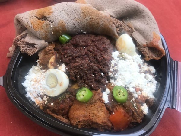 The Katenga Special includes tibs firfir, kitfo, plenty of ayib (house-made cottage cheese), a boiled egg and injera bread. LIGAYA FIGUERAS/LIGAYA.FIGUERAS@AJC.COM