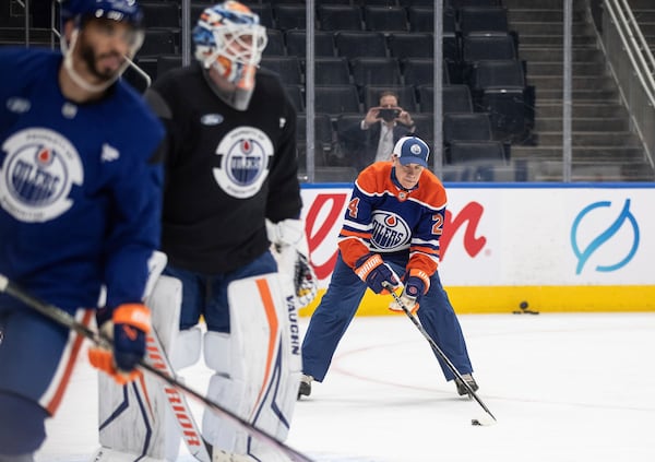 Canadian Prime Minister Mark Carney skates with the Edmonton Oilers NHL hockey team during a visit to Edmonton, Alberta, Thursday, March 20, 2025. (Jason Franson/The Canadian Press via AP)