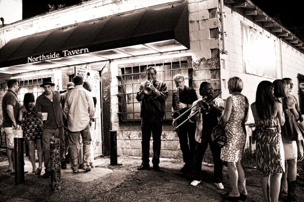 Members of the Wasted Potential Brass Band play outside the Northside Tavern. Courtesy of Corbin Brown