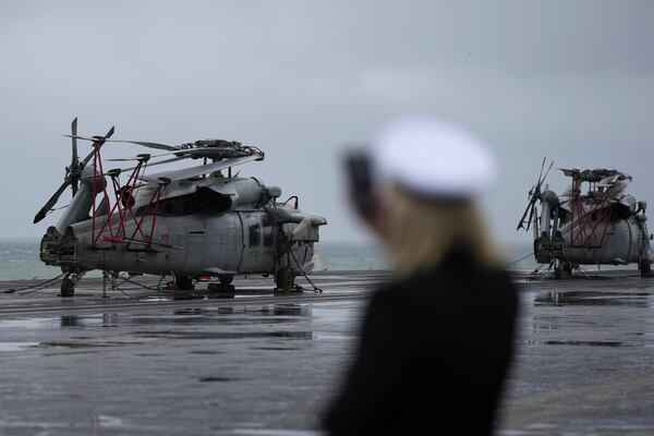 U.S. MH-60 Seahawk helicopters are seen on the flight deck of the Nimitz-class nuclear-powered aircraft carrier USS Carl Vinson at a port in Busan, South Korea, Monday, March 3, 2025. (AP Photo/Lee Jin-man, Pool)