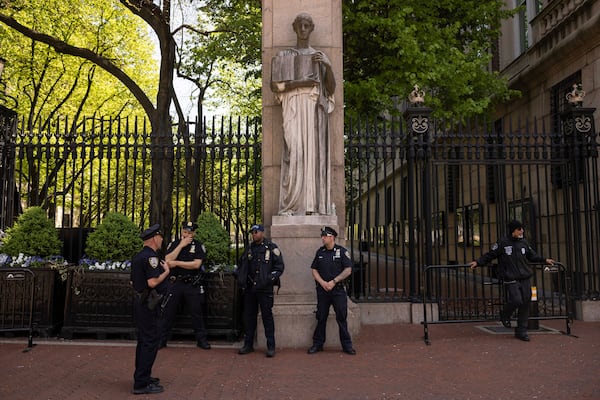 FILE - Police officers stand guard outside Columbia University, Thursday, May 2, 2024, in New York. (AP Photo/Yuki Iwamura, File)